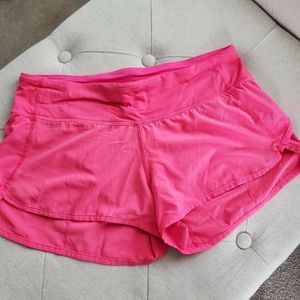 Pink Lululemon running shorts
